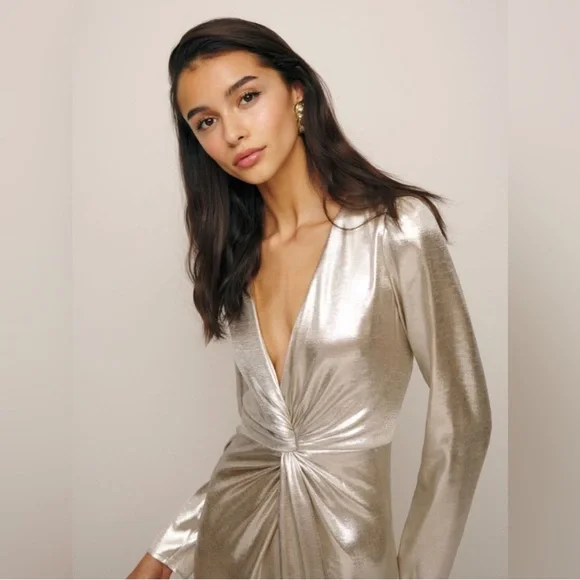 This is a Reformation Gatsby Dress in a silver or champagne color new with tags